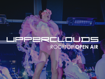 A performer in a pink costume dances on a rooftop at night; text reads UPPERCLOUDS ROOFTOP OPEN AIR.