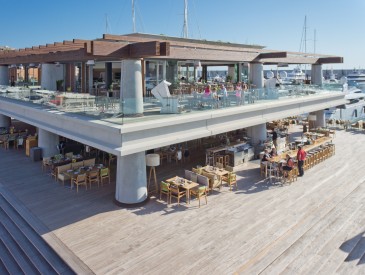 Bird's eye view of the marina in Port Adriano with coast by east and Sansibar Wine